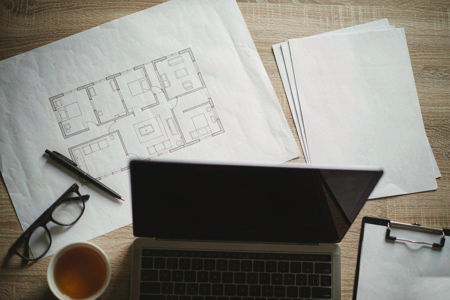 Home Desk with floor plans and property comparison sheets