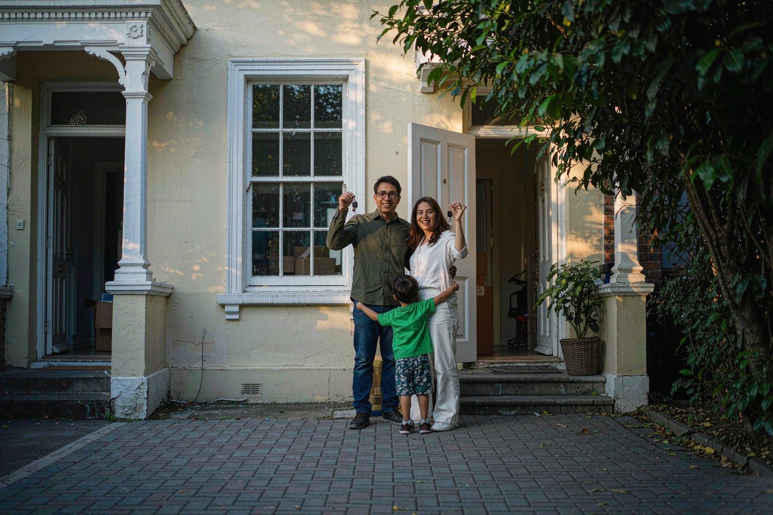 Home Family outside their newly purchased home